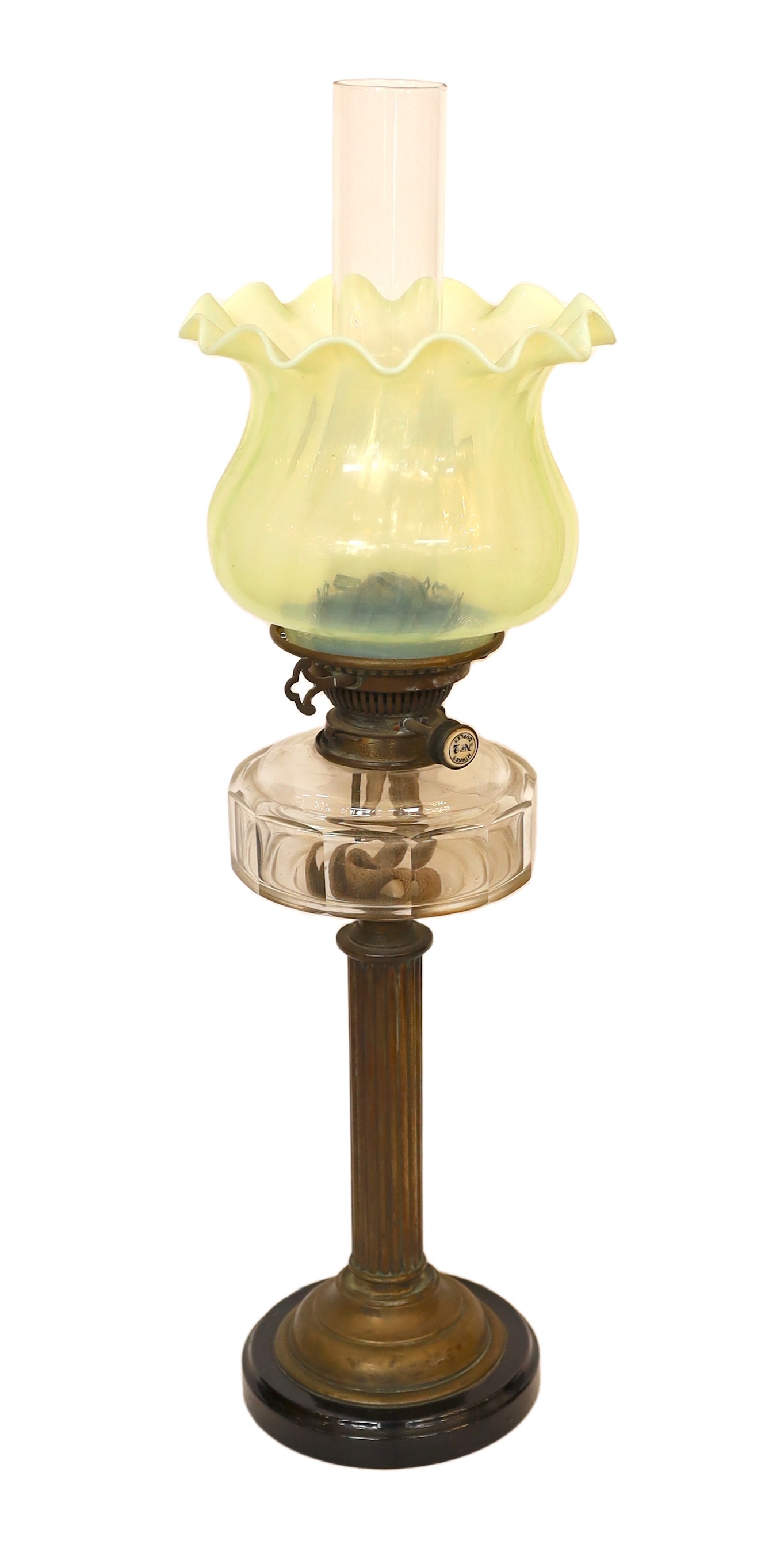 An Edwardian brass oil lamp with cut glass reservoir, Hinks No2 duplex mechanism, Vaseline shade and flue, height overall 67cm